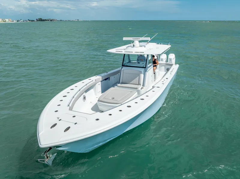 Slide: The Image of 2024 Yellowfin 39 boat cruising on open water under clear skies. - 3