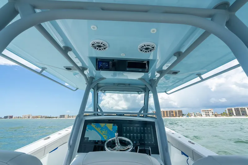 Slide: The Image of 2024 Yellowfin 39 boat cockpit with navigation system, ocean view, and modern design. - 32