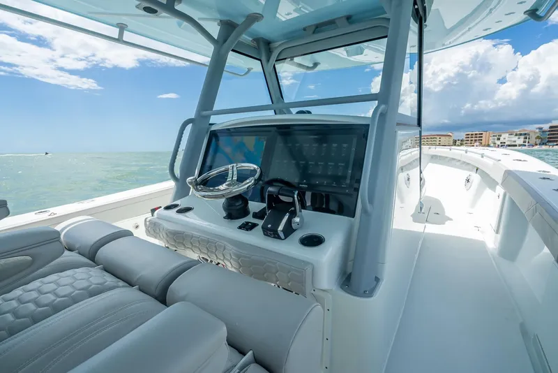 Slide: The Image of 2024 Yellowfin 39 boat interior with modern helm and ocean view. - 33