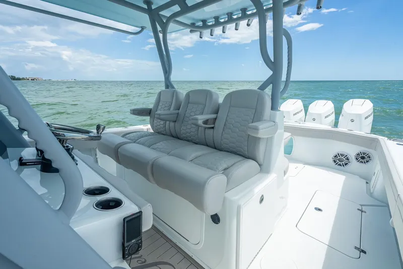 Slide: The Image of 2024 Yellowfin 39 boat interior with plush seating and ocean view. - 39