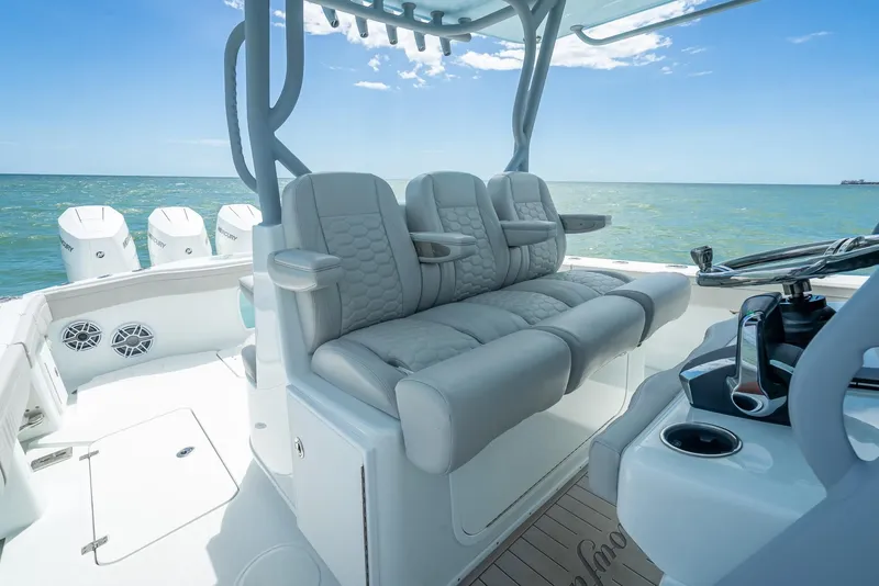 Slide: The Image of 2024 Yellowfin 39 boat interior with plush seating and ocean view. - 40