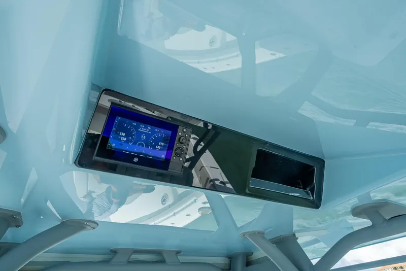 Slide: The Image of 2024 Yellowfin 39 boat dashboard with digital display and controls. - 41