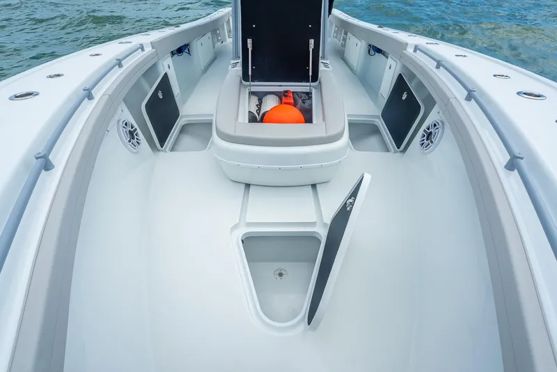Slide: The Image of 2024 Yellowfin 39 boat interior with storage compartments and open hatches. - 45