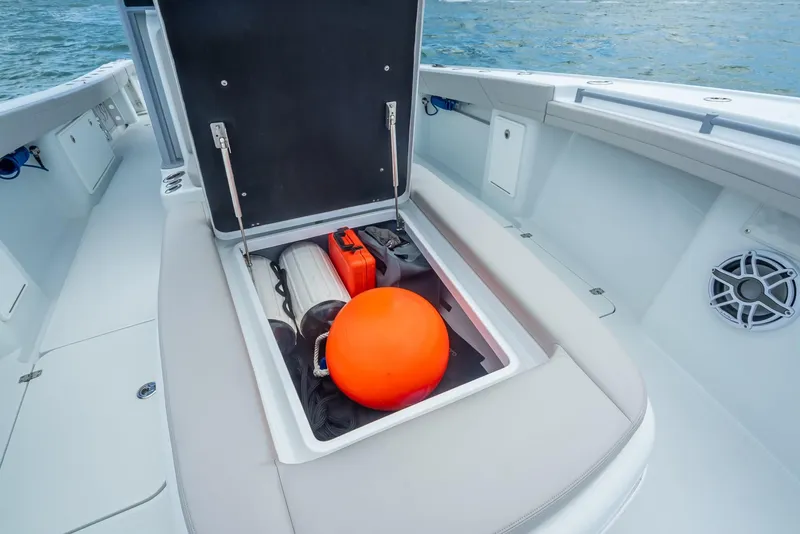 Slide: The Image of 2024 Yellowfin 39 boat storage compartment with safety equipment and gear. - 47