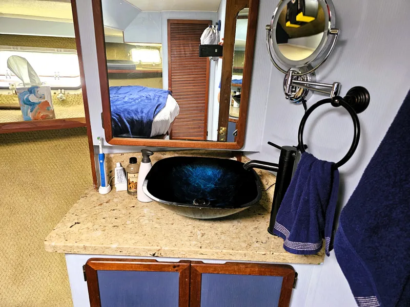 Slide: The Image of 1984 Uniflite 42 Double Cabin bathroom with modern sink and mirror. - 15