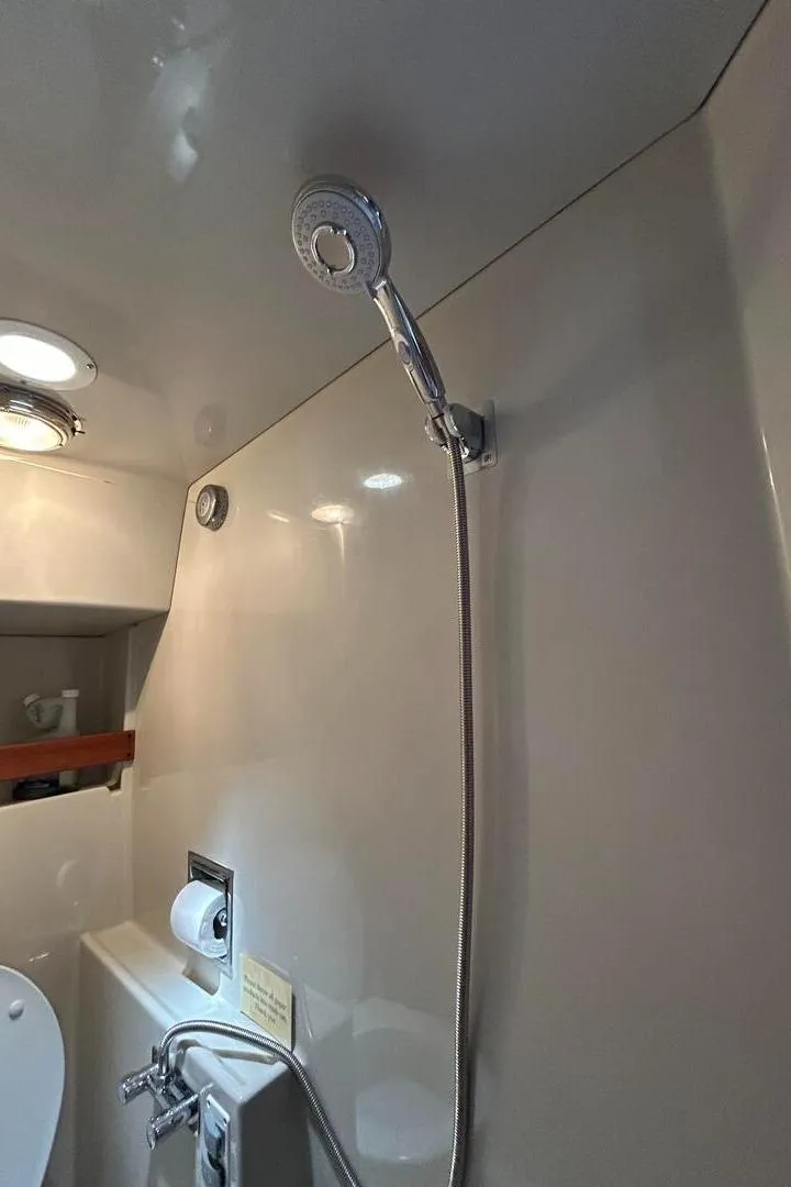Slide: The Image of 1984 Uniflite 42 Double Cabin bathroom with showerhead and modern fixtures. - 19