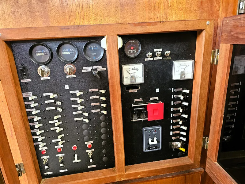 Slide: The Image of Electrical panel of a 1984 Uniflite 42 Double Cabin boat with gauges and switches. - 21