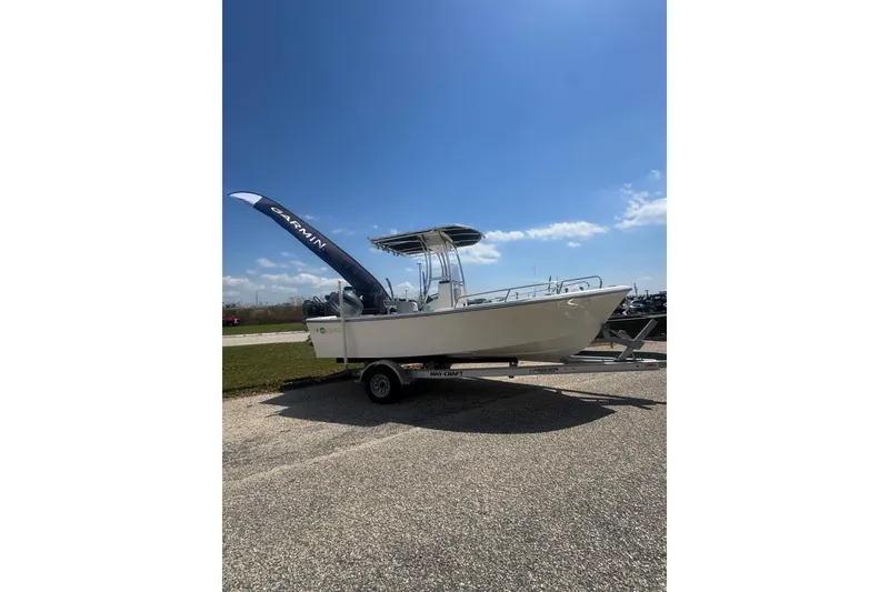 Slide: The Image of 2024 May-Craft 1900CC boat on trailer under clear blue sky. - 27
