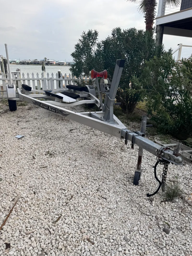 Slide: The Image of Boat trailer on gravel near water, Blazer Bay 1900, 2017 model. - 4