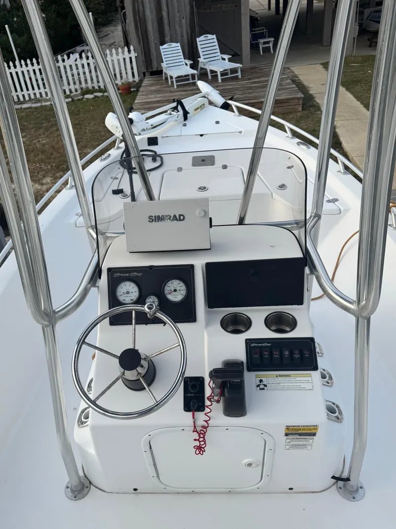 Slide: The Image of 2017 Blazer Bay 1900 boat console with steering wheel and navigation equipment. - 7
