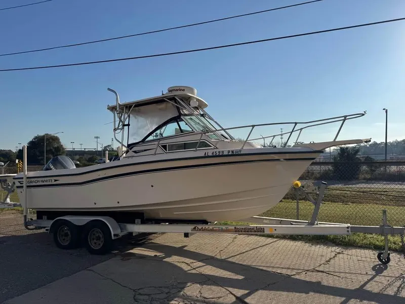 The Image of 1993 Grady-White Seafarer 22 boat on trailer, parked outdoors. - 1