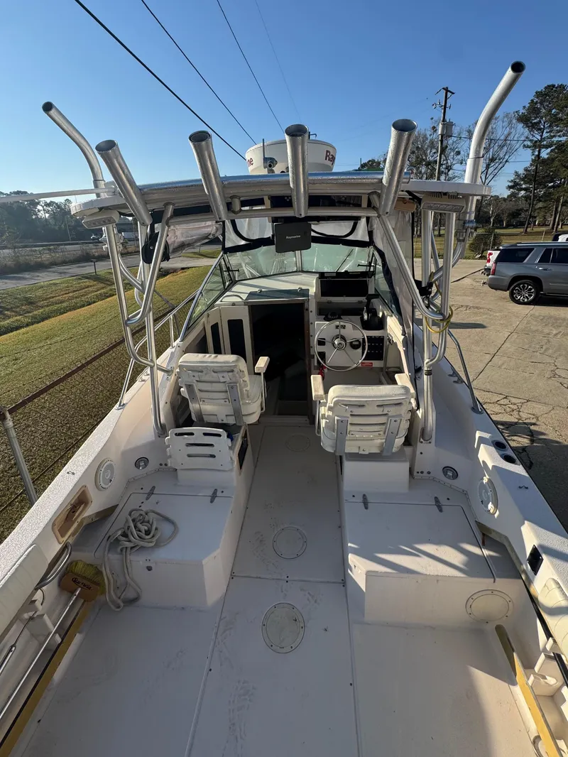 Slide: The Image of 1993 Grady-White Seafarer 22 boat interior with helm and seating. - 3