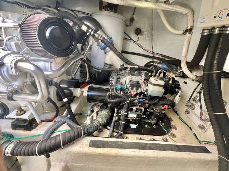 Slide: The Image of Engine room of 2017 Sabre 48 Salon Express with visible components and wiring. - 12