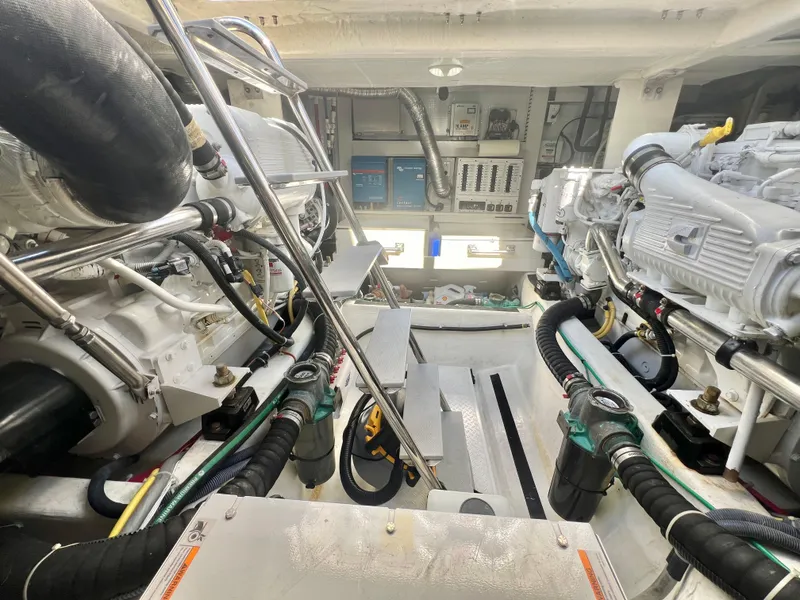 Slide: The Image of Engine room of 2017 Sabre 48 Salon Express, showcasing dual engines and mechanical components. - 14