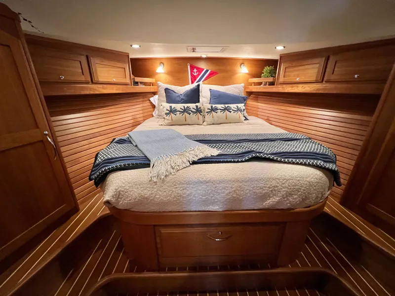 Slide: The Image of Luxurious bedroom interior of 2017 Sabre 48 Salon Express yacht with cozy bedding. - 16