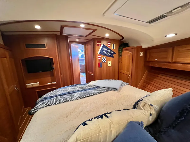 Slide: The Image of Luxurious cabin interior of 2017 Sabre 48 Salon Express yacht with cozy bedding and nautical decor. - 19