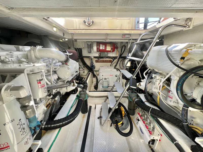 Slide: The Image of Engine room of 2017 Sabre 48 Salon Express, showcasing dual engines and mechanical systems. - 20