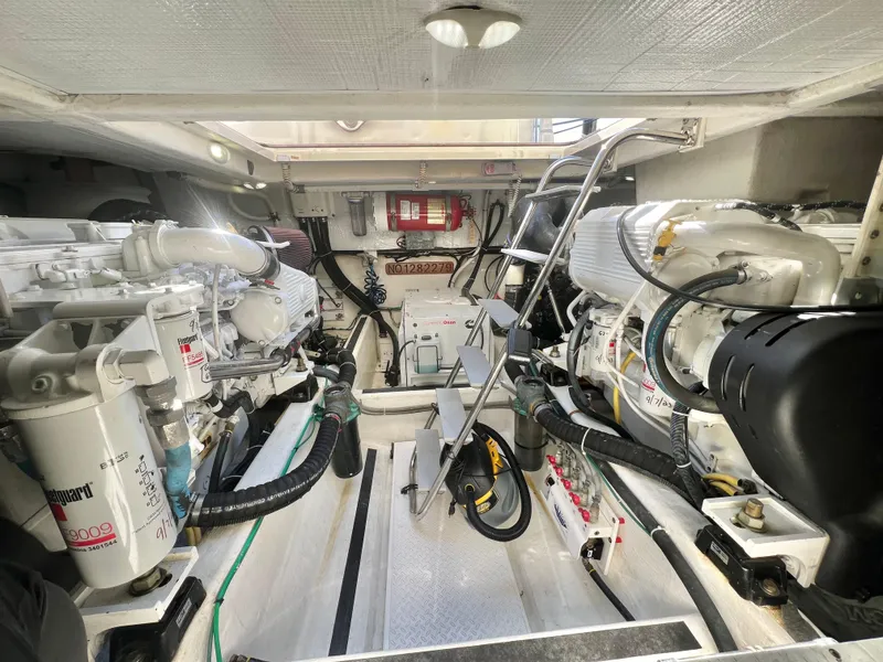 Slide: The Image of Engine room of 2017 Sabre 48 Salon Express, showcasing dual engines and mechanical components. - 28