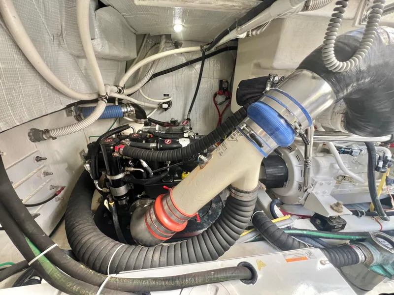 Slide: The Image of Engine room of 2017 Sabre 48 Salon Express with visible hoses and components. - 33