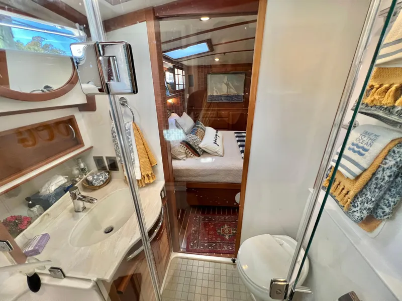Slide: The Image of Interior of 2017 Sabre 48 Salon Express with bathroom and bedroom. - 35