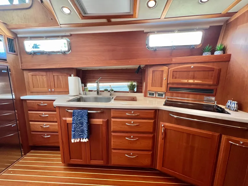 Slide: The Image of Interior of 2017 Sabre 48 Salon Express with elegant wooden kitchen. - 40