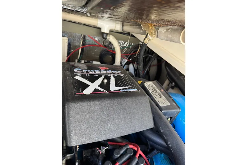 Slide: The Image of Engine compartment of a 1998 Pursuit 2800 Walkaround with Crusader XL engine. - 24