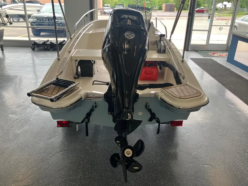 Slide: The Image of 2025 Boston Whaler 130 Super Sport boat, rear view in showroom. - 4
