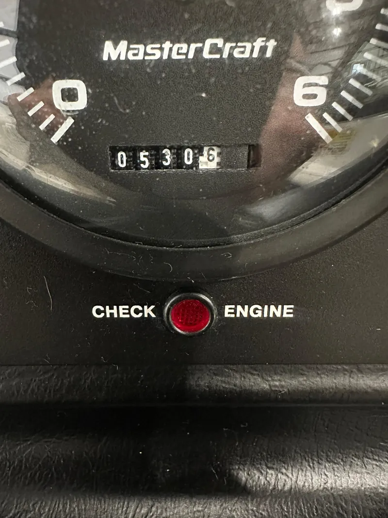 Slide: The Image of Close-up of 1998 MasterCraft Pro Star 190 dashboard with odometer and check engine light. - 12