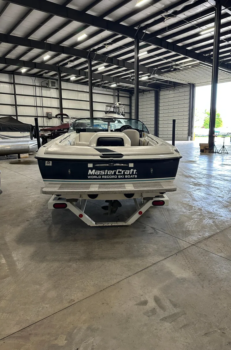 Slide: The Image of 1998 MasterCraft Pro Star 190 boat in a spacious indoor storage facility. - 3