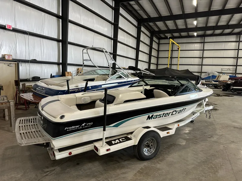 Slide: The Image of 1998 MasterCraft Pro Star 190 boat in storage facility on trailer. - 5