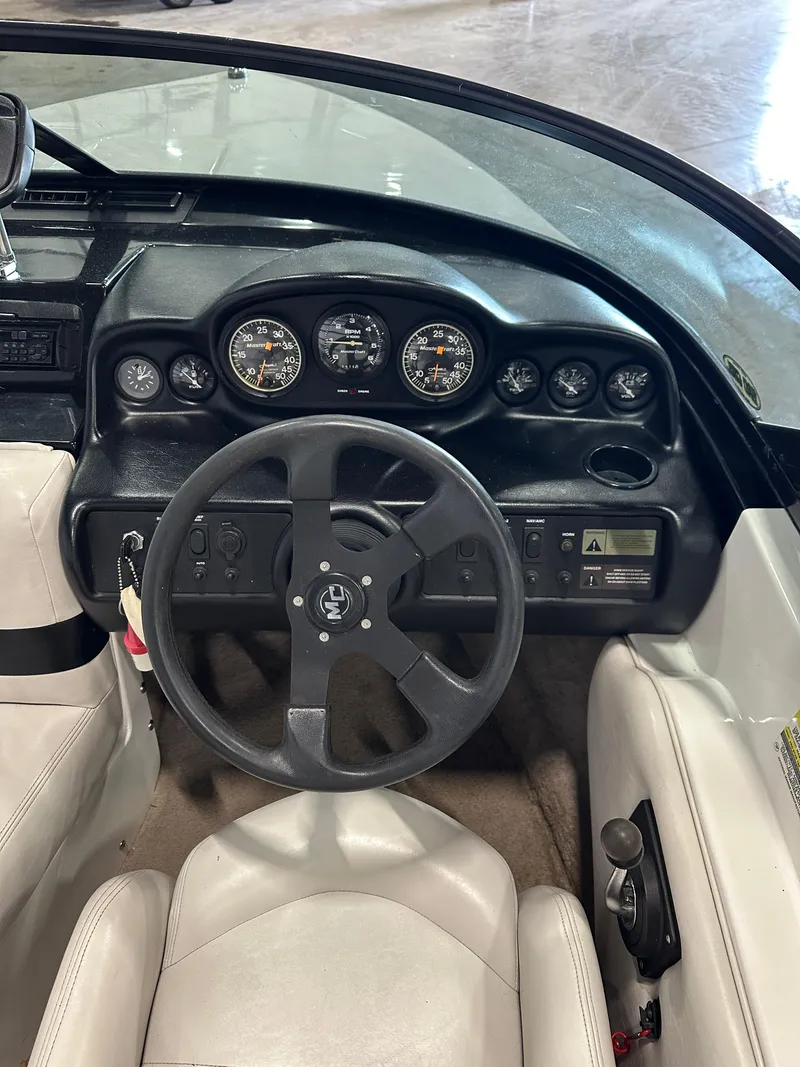 Slide: The Image of 1998 MasterCraft Pro Star 190 dashboard with steering wheel and gauges. - 8