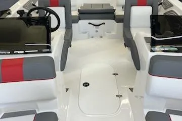Slide: The Image of 2025 Tahoe T21 boat interior with gray and red seating, modern dashboard, and spacious layout. - 37