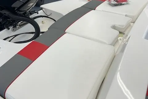 Slide: The Image of 2025 Tahoe T21 boat interior with white, gray, and red cushioned seating. - 93
