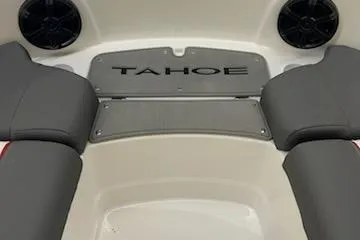 Slide: The Image of 2025 Tahoe T21 boat interior with gray seating and speakers. - 94