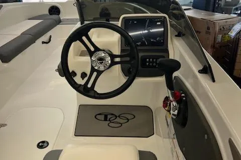 Slide: The Image of 2025 Tahoe T21 boat interior with steering wheel and control panel. - 96