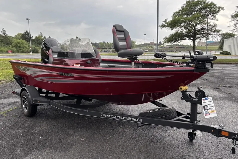 Slide: The Image of 2025 Ranger VS1682SC Reata boat on trailer, parked outdoors. - 1