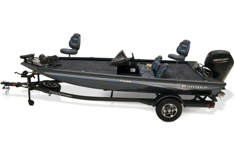 Slide: The Image of 2025 Ranger RT188 boat interior with steering wheel and seating, parked outdoors. - 3
