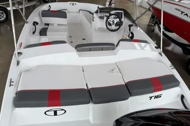 Slide: The Image of 2025 Tahoe T16 boat interior with modern seating and steering wheel, showcasing sleek design. - 5