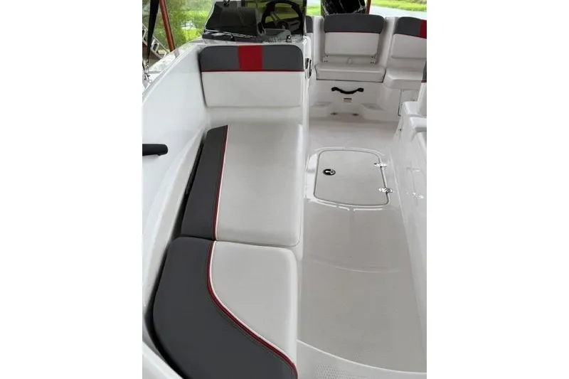Slide: The Image of 2025 Tahoe T16 boat interior with white and gray seating, red accents, and spacious layout. - 9