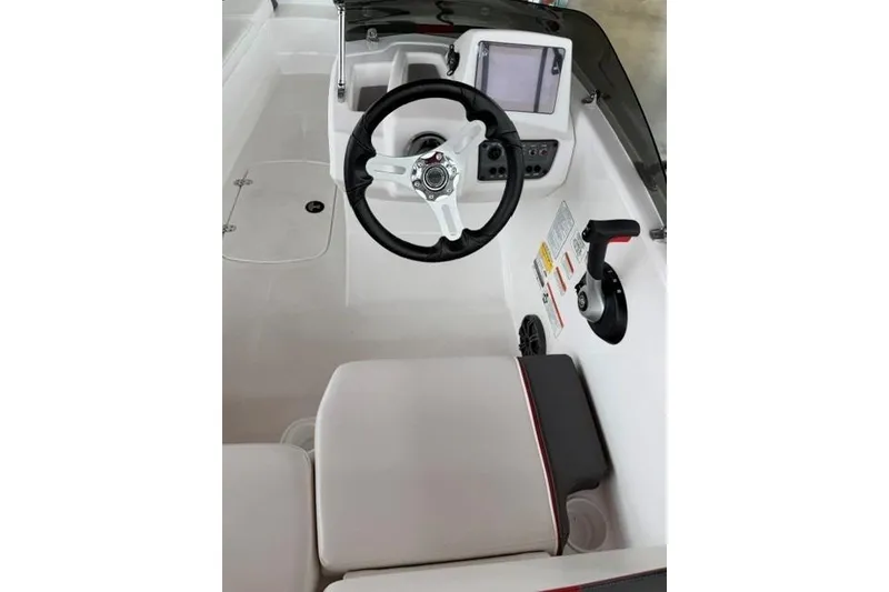 Slide: The Image of 2025 Tahoe T16 boat cockpit with steering wheel, control panel, and seating. - 6