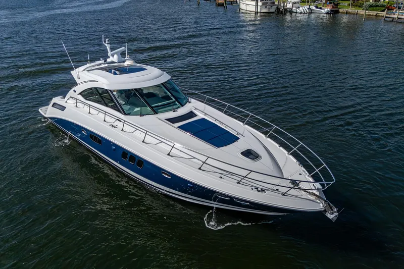Slide: The Image of 2012 Sea Ray 540 Sundancer yacht cruising on calm waters. - 10