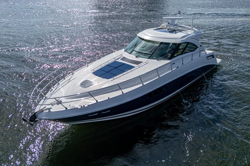 Slide: The Image of 2012 Sea Ray 540 Sundancer yacht cruising on open water. - 12