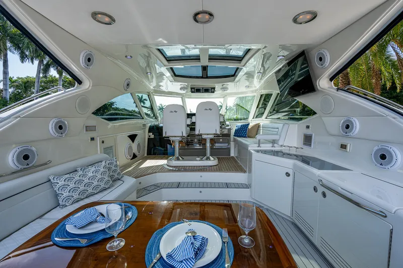 Slide: The Image of Luxurious 2012 Sea Ray 540 Sundancer yacht interior with elegant dining setup and modern amenities. - 20