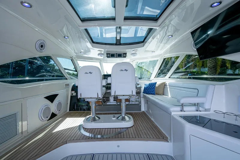 Slide: The Image of Interior of 2012 Sea Ray 540 Sundancer yacht with modern seating and panoramic windows. - 22