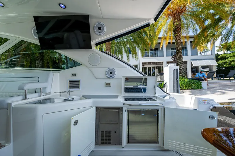 Slide: The Image of 2012 Sea Ray 540 Sundancer yacht interior with modern amenities and outdoor view. - 23