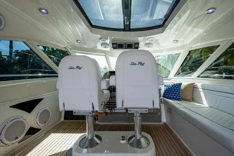 Slide: The Image of Interior of 2012 Sea Ray 540 Sundancer yacht with plush seating and modern design. - 27