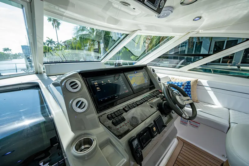 Slide: The Image of Helm of 2012 Sea Ray 540 Sundancer yacht with modern navigation system and luxurious seating. - 30