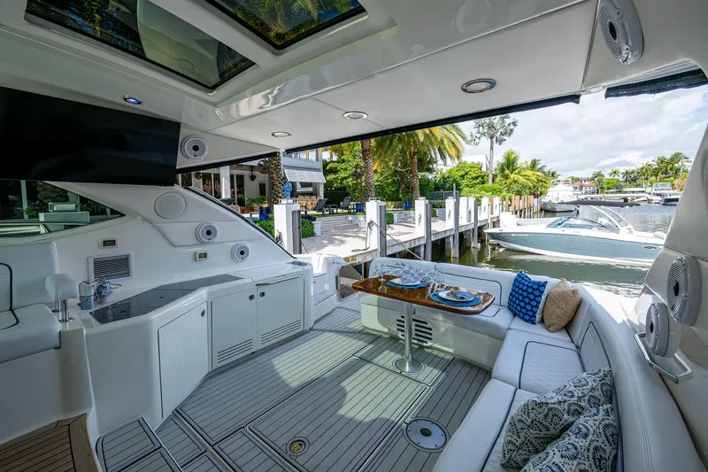 Slide: The Image of Luxurious 2012 Sea Ray 540 Sundancer yacht interior with elegant seating and dining area. - 34