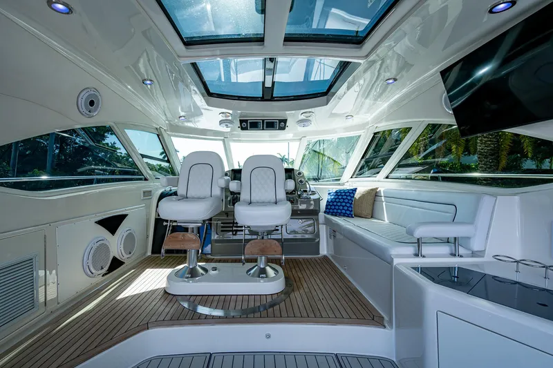 Slide: The Image of Luxurious interior of 2012 Sea Ray 540 Sundancer yacht with modern seating and panoramic windows. - 36