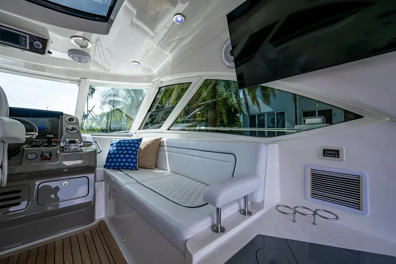 Slide: The Image of Luxurious interior of 2012 Sea Ray 540 Sundancer yacht with plush seating and modern amenities. - 39